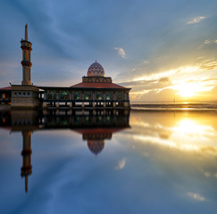 Beautiful mosque by the beach at sunset