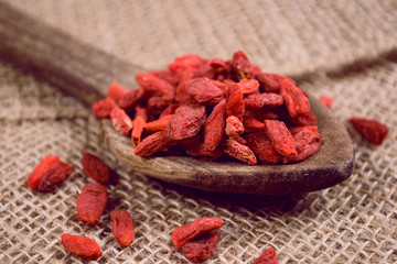 Goji berries on wooden table