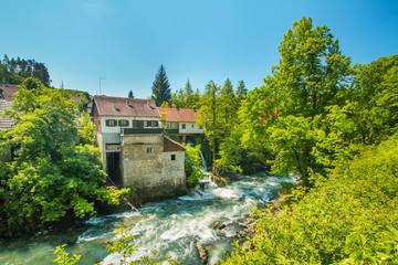 Fototapeta na wymiar Korana river canyon and beautiful village of Rastoke near Slunj in Croatia, old water mills on waterfalls 
