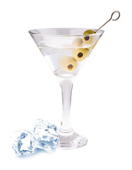 Delicious cocktail with olives and ice cubes in martini glass on a white background.