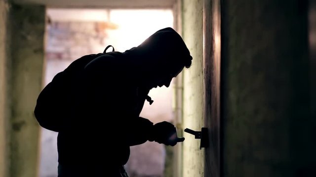 Thief hacking the lock