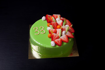 Many fresh berries on bright mousse cake