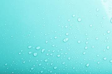 Drops of water on a color background. Blue. Shallow depth of fie