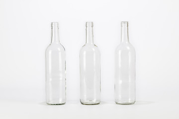 Three empty glass bottle