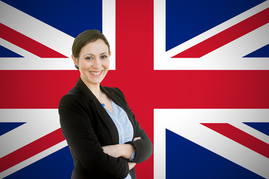 Young teacher standing before of the british flag