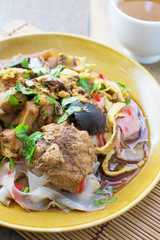 china noodle mixed with egg, sausage, pork, mushroom and tofu