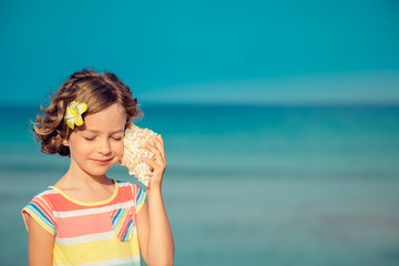 Child relaxing on the beach