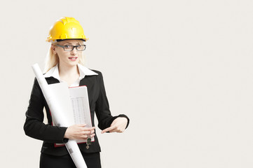 Young female architect/construction engineer  isolated on white