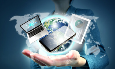 Modern technology in hand. Elements of this image furnished by NASA