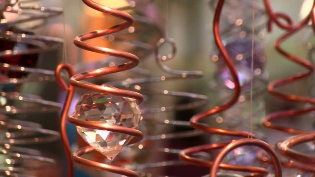 Spinning ornament with crystal inside.