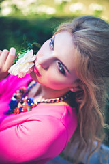 Naklejka premium Young girl with white rose