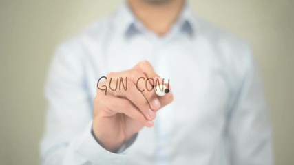 Gun Control, man writing on transparent screen