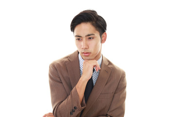 悩むビジネスマン
