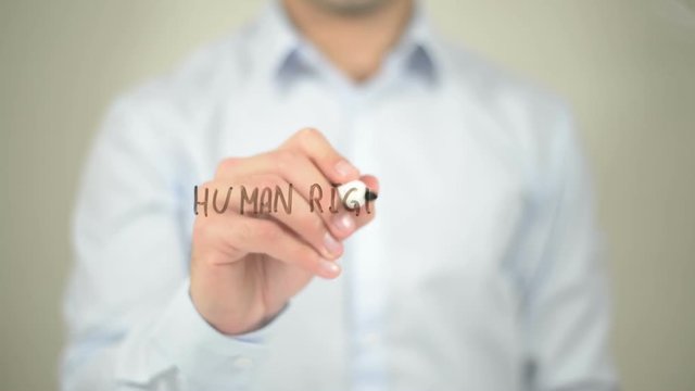Human Rights Law, man writing on transparent screen