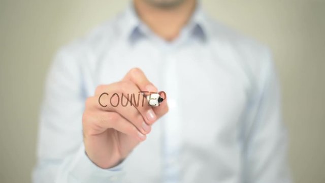 Counterfeit , man writing on transparent screen