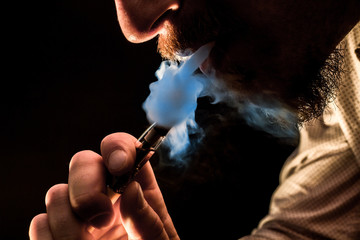 Fototapeta premium Vaping Bearded Man