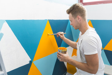 young apprentice painter in professional training