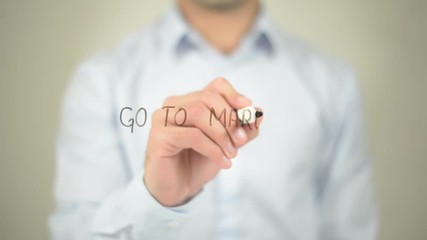 Go To Market , man writing on transparent screen - Powered by Adobe