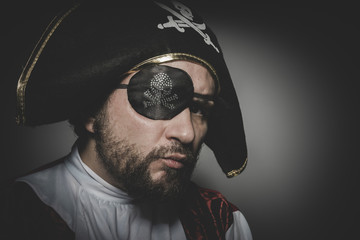 Vintage, man pirate with eye patch and old hat with funny faces