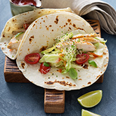 Chicken tacos with salad and tomatoes