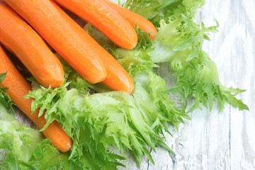 Raw peeled carrots and lettuce