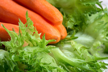 Raw peeled carrots and lettuce