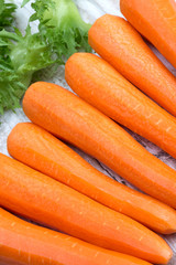 Raw peeled carrots and lettuce