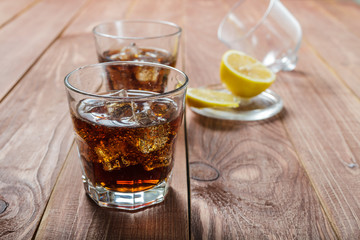 The cooling drink with ice and lemon