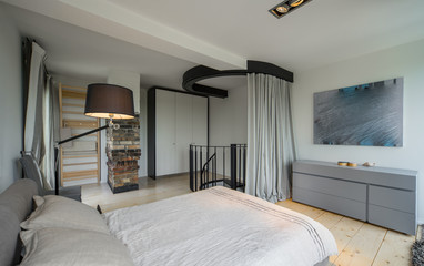 Bedroom in a modern house. Modern interior in private flat.