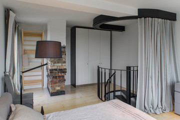 Bedroom in a modern house. Modern interior in private flat.