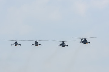 group of military helicopters Mi-24 (Hind) in the sky