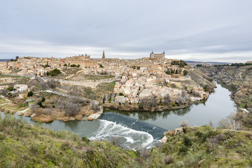 Fototapeta na wymiar Ancient city of Toledo, Waterfall on the Tagus River. Spain