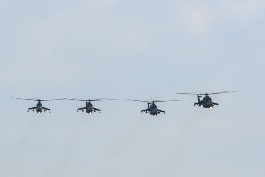 group of military helicopters Mi-24 (Hind) in the sky