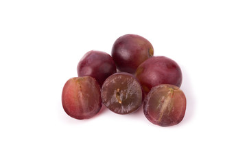 Ripe red grape with leaves isolated on white
