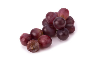 Ripe red grape with leaves isolated on white