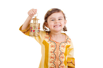 Ramadan Kareem - Happy young girl celebrating Ramadan with her lantern
