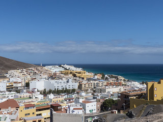 Fototapeta na wymiar Ocean village at a mountain slope Fuerteventura.