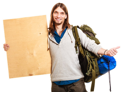 Man hiker backpacker with blank wood copy space ad