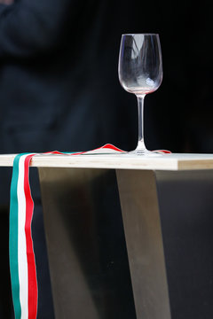 Empty wine glass and Ribbon Tape Flag of Hungary