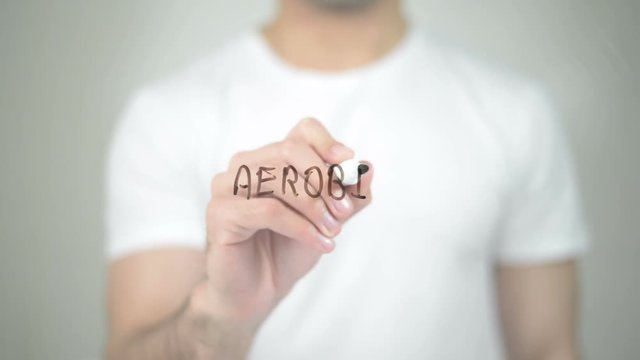 Aerobic, man writing on transparent screen