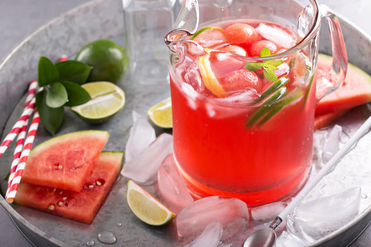 Watermelon drink with lime in a pitcher