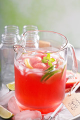 Fototapeta na wymiar Watermelon drink with lime in a pitcher