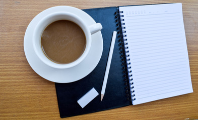 office tatle with cup of coffee