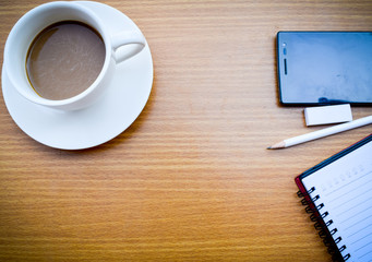 office tatle with cup of coffee