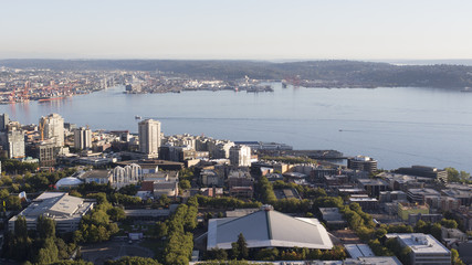 Obraz premium Urban Downtown City Aerial Panoramic View. Scenic Northwest Buildings like Key Arena, Waterfront Elliot Bay Background