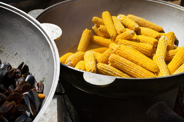Corn in big cauldron. Street food