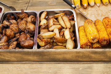 Grilled corn, mushrooms and potato. Street food