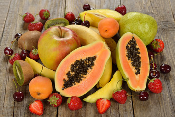 Fresh papaya and various fruits