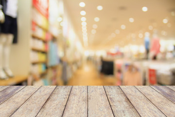 Empty table and blur clothing store with bokeh background