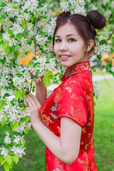 Beautiful asian girl in traditional chinese red dress.